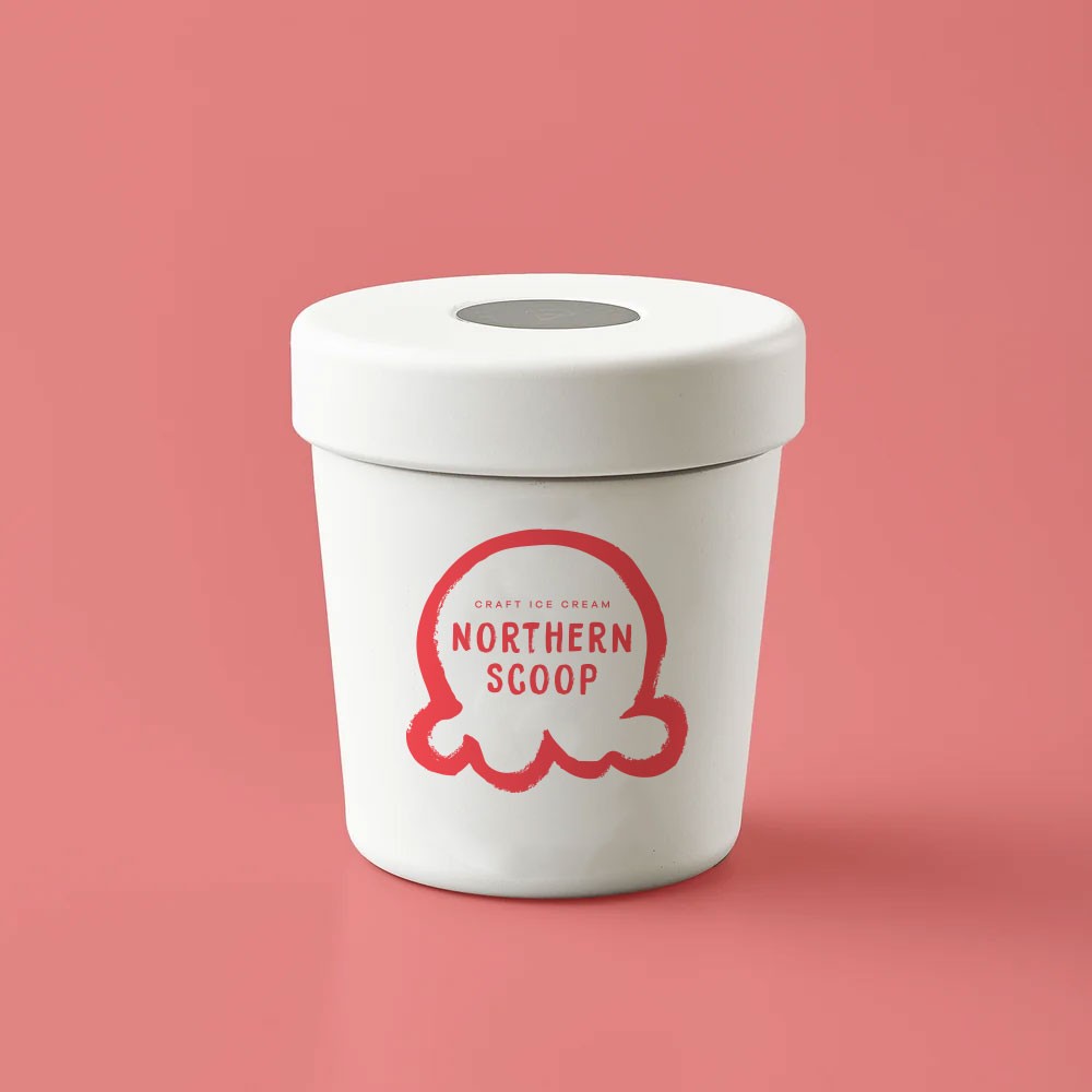 A single Northern Scoop pint mockup on a coral field