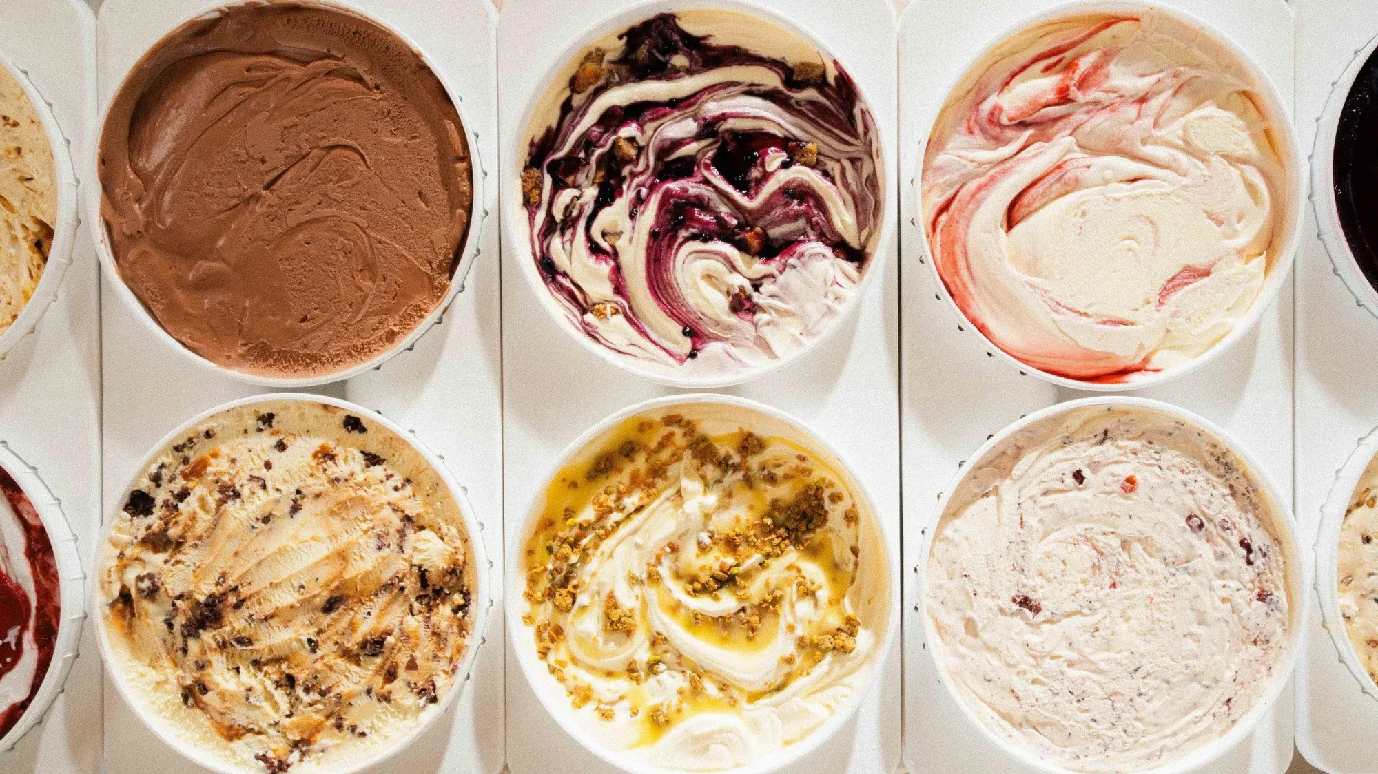 An overhead grid of Northern Scoop ice cream pints, showing assorted flavors