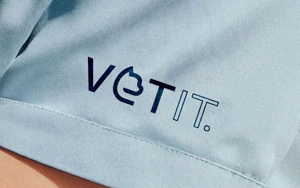 The VetIt wordmark embroidered on a scrub shirt sleeve